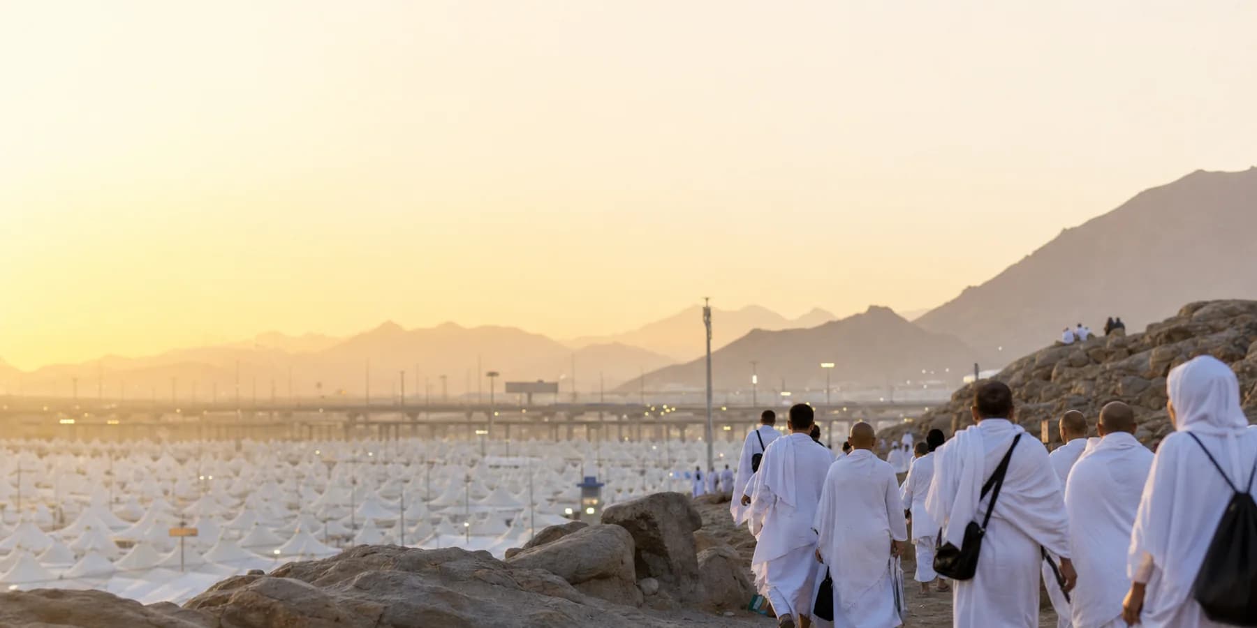 Pilgrims in Ihram overlooking Mina during Hajj